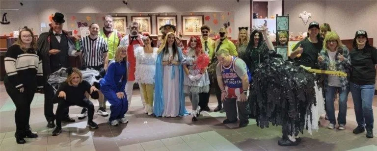 Costumed FNBB staff celebrating Halloween